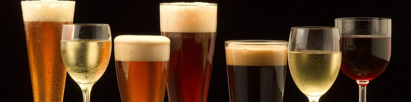 An assortment of beverages, including various beers and wines, displayed in distinct glasses against a black background, highlighting diverse drink options.